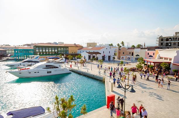 Yachts moored at Limassol Marina beside the waterfront promenade