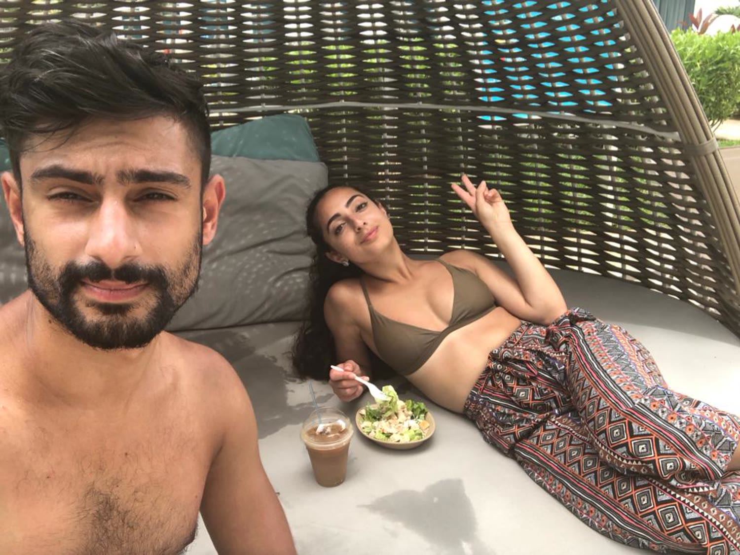 Rohan and Natalie relaxing poolside