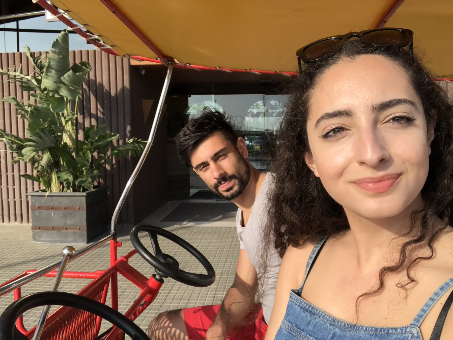 Rohan and Natalie on a pedal cart